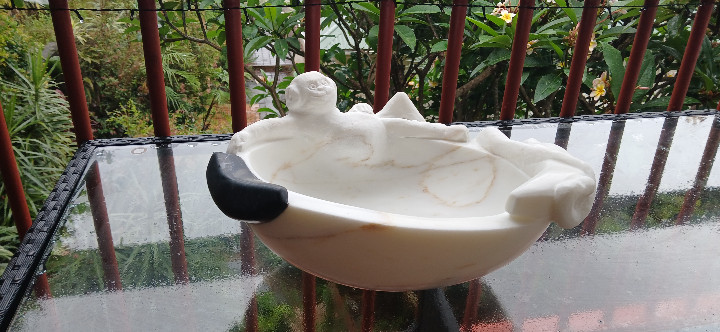 Marble bird bath with sculptural detail